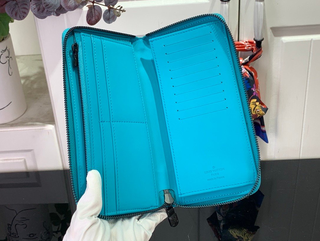 LV light blue (embossed) zippy wallet card holder wallet
