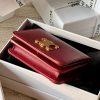 triomphe compact wallet in shiny calfskin Claret