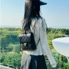 Chanel 23K litchi leather ball pattern chain backpack AS4490W1080