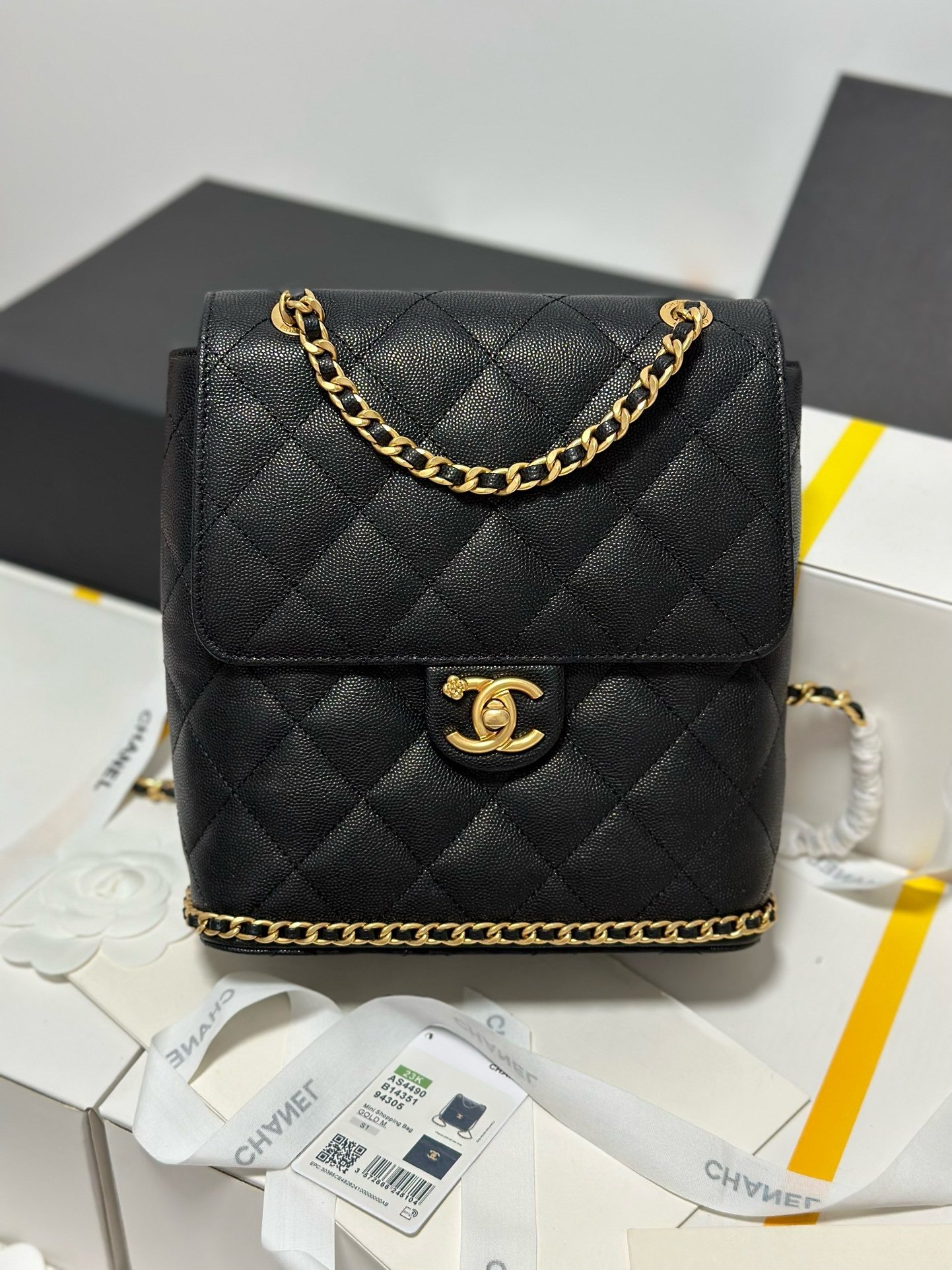 Chanel 23K litchi leather ball pattern chain backpack AS4490W1080