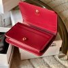 triomphe compact wallet in shiny calfskin Claret