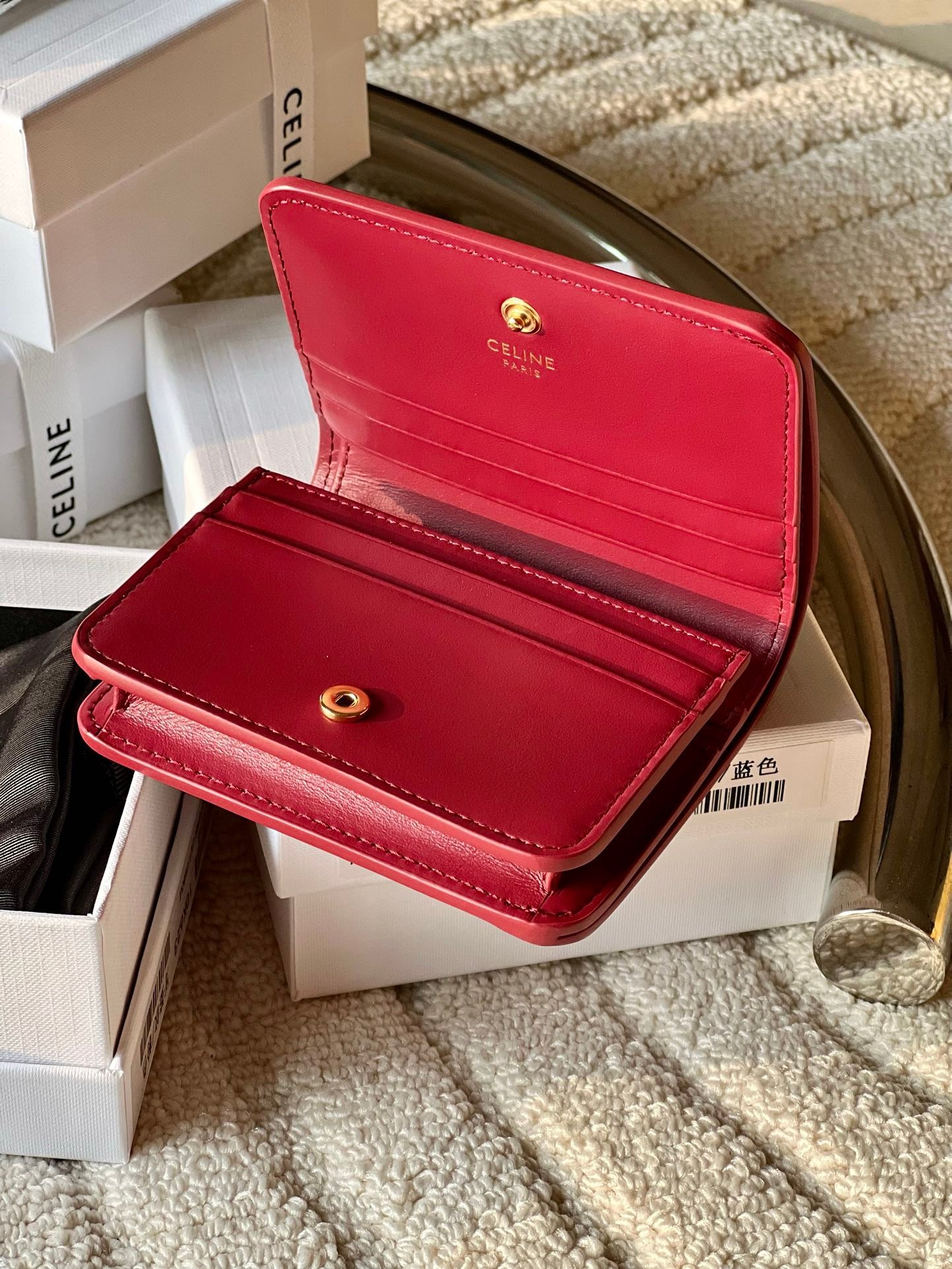 triomphe compact wallet in shiny calfskin Claret