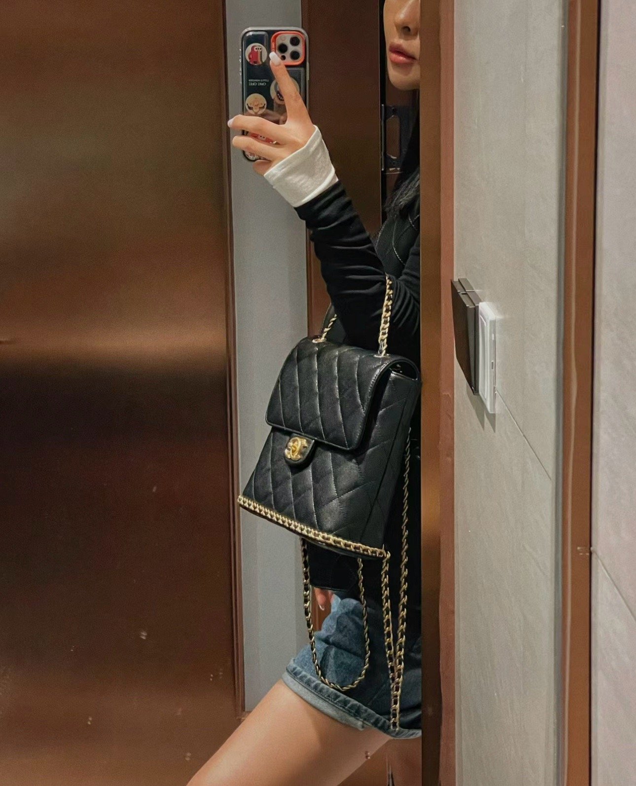 Chanel 23K litchi leather ball pattern chain backpack AS4490W1080
