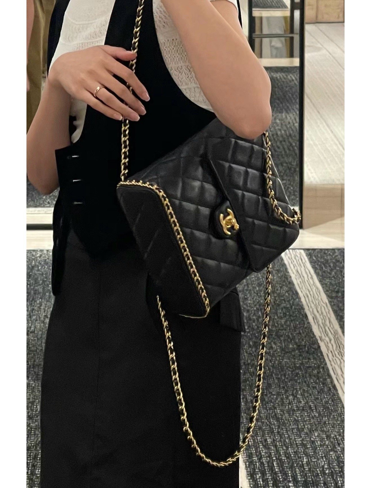 Chanel 23K litchi leather ball pattern chain backpack AS4490W1080
